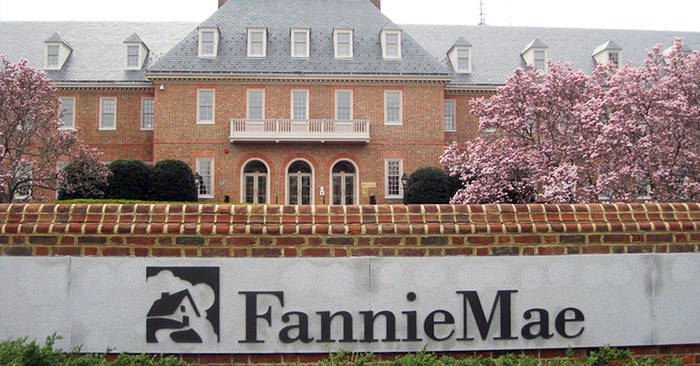 Fannie Mae logo on wall in front of big house